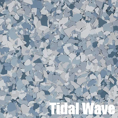 Blue and gray epoxy flake flooring with multi-colored chip pattern on seamless base