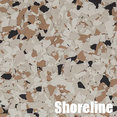Epoxy floor with tan, brown, and black decorative flakes on cream base