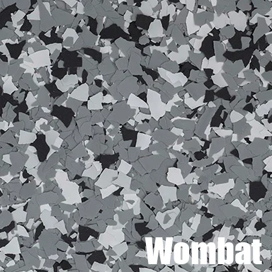 Gray epoxy flooring with black, white, and gray decorative flakes throughout